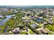 Aerial view showcases the neighborhood's proximity to canals and green spaces with private docks at 951 Sea Fox Rd, Venice, FL 34293