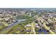 Breathtaking aerial view of a community with winding waterways and charming waterfront homes at 951 Sea Fox Rd, Venice, FL 34293
