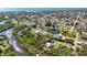 Expansive aerial view of a waterfront community featuring lush greenery and serene water views at 951 Sea Fox Rd, Venice, FL 34293