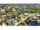 Stunning aerial perspective showcasing residences along a tranquil canal with natural beauty at 951 Sea Fox Rd, Venice, FL 34293