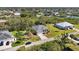 Community aerial view showcasing waterfront homes, lush landscaping and waterway access at 951 Sea Fox Rd, Venice, FL 34293