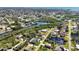 Overhead view of a waterfront community, highlighting the area's natural beauty, canals and nearby lake at 951 Sea Fox Rd, Venice, FL 34293