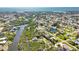 Beautiful aerial perspective of a neighborhood with direct access to waterways and natural surroundings at 951 Sea Fox Rd, Venice, FL 34293