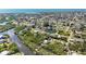 Picturesque aerial view of a coastal community with houses nestled along the canal at 951 Sea Fox Rd, Venice, FL 34293