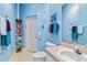 Whimsical bathroom with blue walls, sink, toilet, and themed decor at 951 Sea Fox Rd, Venice, FL 34293