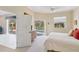 Bright bedroom with a pool view, neutral walls and plush carpet at 951 Sea Fox Rd, Venice, FL 34293