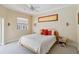 Inviting bedroom with plush carpeting and an abundance of natural light at 951 Sea Fox Rd, Venice, FL 34293
