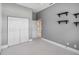 Grey bedroom with large closet and decorative shelving at 951 Sea Fox Rd, Venice, FL 34293