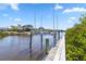 Private dock with a boat lift, offering convenient access to the waterfront at 951 Sea Fox Rd, Venice, FL 34293