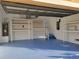 Spacious garage with epoxy flooring and custom shelving for optimal storage solutions at 951 Sea Fox Rd, Venice, FL 34293