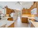 Well-lit kitchen with tiled backsplash, stainless steel appliances, and ample counter space at 951 Sea Fox Rd, Venice, FL 34293