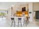 Open kitchen with breakfast bar, modern lighting and stainless steel appliances at 951 Sea Fox Rd, Venice, FL 34293