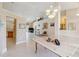 Open-concept living room with tile floors, vaulted ceilings and natural light at 951 Sea Fox Rd, Venice, FL 34293