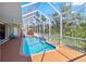 Stunning screened-in pool with a covered lanai, providing privacy and comfort at 951 Sea Fox Rd, Venice, FL 34293