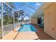 Inviting screened-in pool area with a covered lanai, perfect for outdoor relaxation at 951 Sea Fox Rd, Venice, FL 34293