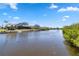 Waterfront homes with docks and landscaping at 951 Sea Fox Rd, Venice, FL 34293