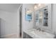Updated bathroom with vanity and a large mirror at 990 Bird Bay Way # 258, Venice, FL 34285