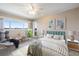 Primary bedroom with views of the water and plenty of natural light at 990 Bird Bay Way # 258, Venice, FL 34285