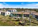 Aerial shot of multi-Gathering residences surrounded by mature trees and lush landscaping at 990 Bird Bay Way # 258, Venice, FL 34285