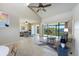 Bright living room features high ceilings, tile floors and a large balcony with water views at 990 Bird Bay Way # 258, Venice, FL 34285