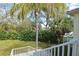 Scenic view of the lush, green backyard from the staircase at 1000 Gardens Edge Dr # 1023, Venice, FL 34285