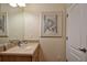 Bright bathroom featuring a large mirror and stylish vanity at 1000 Gardens Edge Dr # 1023, Venice, FL 34285