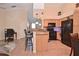 Bright kitchen featuring a breakfast bar, granite countertops and stainless steel appliances at 1000 Gardens Edge Dr # 1023, Venice, FL 34285