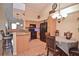 Bright open kitchen featuring a breakfast bar, granite countertops, and stainless steel appliances at 1000 Gardens Edge Dr # 1023, Venice, FL 34285