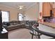 Spacious living room adjacent to the kitchen, featuring a large sectional sofa and ample natural light at 1000 Gardens Edge Dr # 1023, Venice, FL 34285