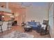 Bright living room with ceiling fan and tile floors throughout, plus cozy decor at 1000 Gardens Edge Dr # 1023, Venice, FL 34285