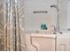 Easy access walk-in shower featuring safety bar and modern shower head at 1000 Gardens Edge Dr # 1023, Venice, FL 34285