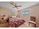 Cozy bedroom with a ceiling fan, natural lighting, and classic furnishings at 1003 N Gondola Dr, Venice, FL 34293