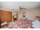 Bedroom featuring warm tones, wood floors, and a closet with louvered doors at 1003 N Gondola Dr, Venice, FL 34293