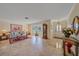 Bright living room with tile floors, a large window, and comfortable seating, perfect for relaxation and entertaining guests at 1003 N Gondola Dr, Venice, FL 34293