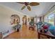 Spacious living area with hardwood floors, archways, and a view into adjacent rooms at 1003 N Gondola Dr, Venice, FL 34293