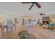 Spacious living area showcasing tile floors, recessed lighting, and a seamless flow into the dining and kitchen areas at 1003 N Gondola Dr, Venice, FL 34293
