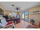 Bright home office features wood floors, ceiling fan, sliding glass doors leading to a patio and view of the outdoors at 1003 N Gondola Dr, Venice, FL 34293