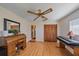 Home office featuring a desk, a closet with louvered doors, and natural light at 1003 N Gondola Dr, Venice, FL 34293