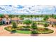 Scenic aerial view of Sarasota National, showcasing the community's landscaping, water features, and golf course at 10064 Cozy Grove Dr, Venice, FL 34293