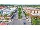 Aerial shot of a well-maintained street lined with palm trees and beautiful buildings at 10064 Cozy Grove Dr, Venice, FL 34293