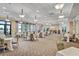 Elegant ballroom with neutral decor and stylish lighting, perfect for hosting events at 10064 Cozy Grove Dr, Venice, FL 34293
