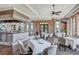 Upscale dining area with a bar, comfortable seating, and pleasant views at 10064 Cozy Grove Dr, Venice, FL 34293