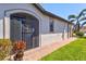 Inviting home with a decorative screen door and well-maintained landscaping along the walkway at 10064 Cozy Grove Dr, Venice, FL 34293