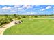 Scenic view of the golf course at Sarasota National, complete with golf carts and neatly manicured greens at 10064 Cozy Grove Dr, Venice, FL 34293