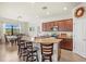 Beautiful kitchen with a large island, granite countertops, and seating for four at the breakfast bar at 10064 Cozy Grove Dr, Venice, FL 34293