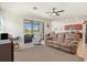 Open floor plan connects the living room to the kitchen, with views of the lanai at 10064 Cozy Grove Dr, Venice, FL 34293