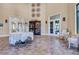 Elegant lobby with stylish decor and access to the dining room and lounge at 10064 Cozy Grove Dr, Venice, FL 34293