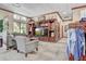 A comfortable lounge space with seating and a large entertainment center in the pro shop at 10064 Cozy Grove Dr, Venice, FL 34293