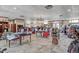 A well-stocked pro shop with various displays of apparel, equipment, and accessories for golf enthusiasts at 10064 Cozy Grove Dr, Venice, FL 34293