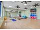 Bright exercise studio with full mirror wall, mats, exercise balls, and natural light at 10064 Cozy Grove Dr, Venice, FL 34293